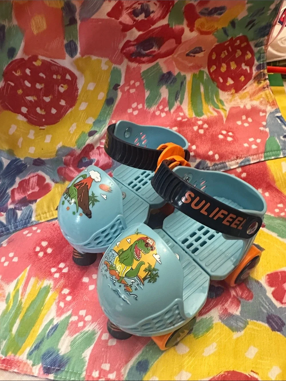 Kids Light Blue Dinosaur Roller Shoes with Orange Wheels